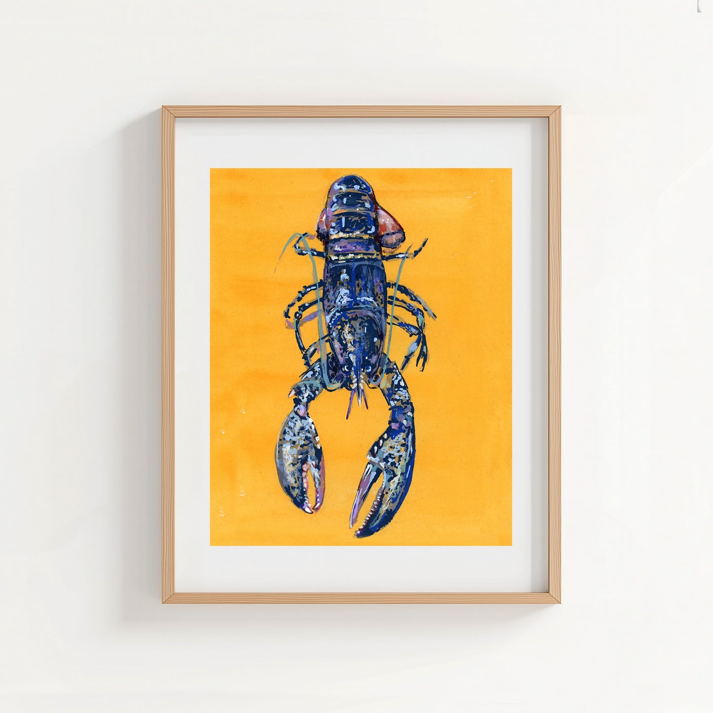 Framed artwork of a blue lobster on a yellow background