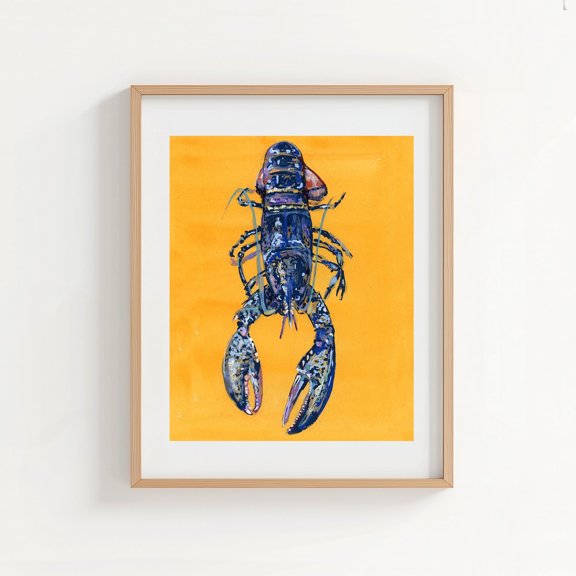 Framed artwork of a blue lobster on a yellow background